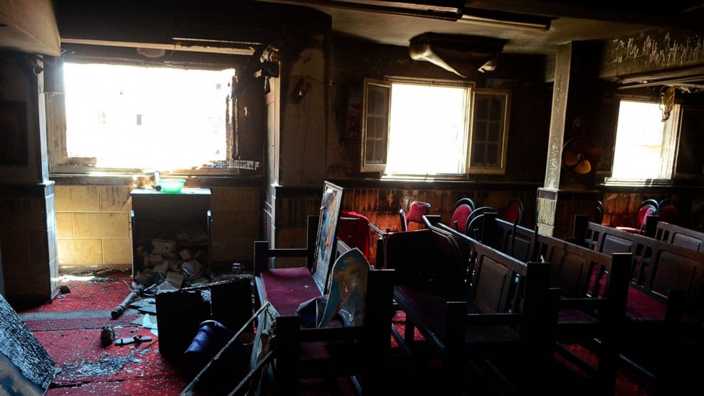 Burned furniture, including wooden tables and chairs, are seen at the site of a fire inside the Abu Sefein Coptic church that killed at least 40 people and injured some 14 others, in the densely populated neighborhood of Imbaba, Cairo Egypt, Sunday, 