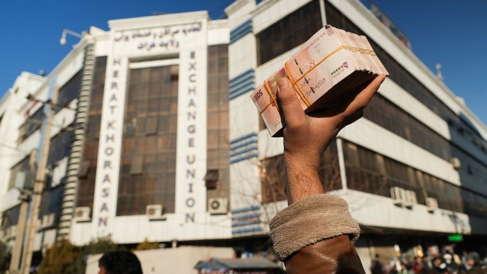 Afghan currency slides, prices surge as economy worsens