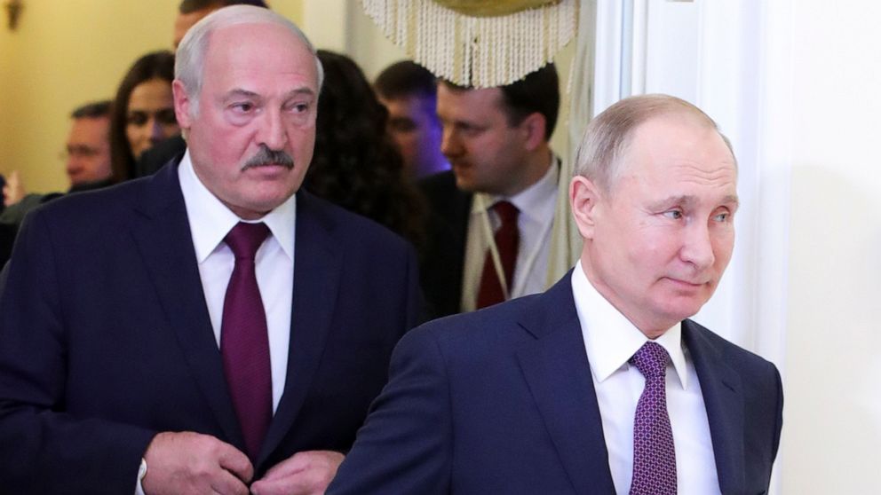 Russian President Vladimir Putin, right, and Belarusian President Alexander Lukashenko walk before a meeting of the Supreme Eurasian Economic Council in St. Petersburg, Russia, Friday, Dec. 20, 2019. The presidents of Russia and Belarus are holding t
