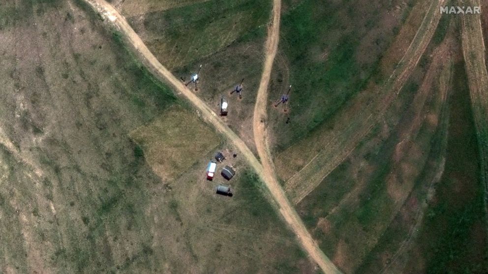 This satellite image provided by Maxar Technologies claims to show M-46 towed field guns and military vehicles positioned in the village of Serha in Eritrea, across the border from the town of Zalambessa in the Tigray region of northern Ethiopia on M