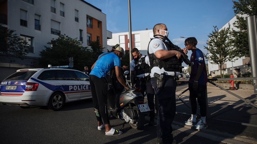 Police officers stop and search a motorbike rider and his passenger who did not wear any helmets, in the Paris suburb of Villiers-le-Bel, Tuesday, June, 15, 2021. In the run-up to France's presidential elections in 2022, crime and policing are again 