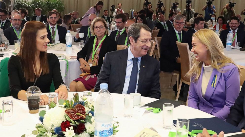 This photo provided by Cyprus press and information office, European Union's energy commissioner Kadri Simson, right, Cyprus president Nicos Anastasiades, center and Cyprus' energy minister Natasa Pilides talk during the East Mediterranean Gas Forum 