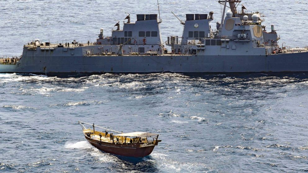 In this Friday, Feb. 12, 2021 photo released by the U.S. Navy, the guided-missile destroyer USS Winston S. Churchill boarded a stateless dhow off the coast of Somalia and interdicted an illicit shipment of weapons and weapon components. The U.S. Navy
