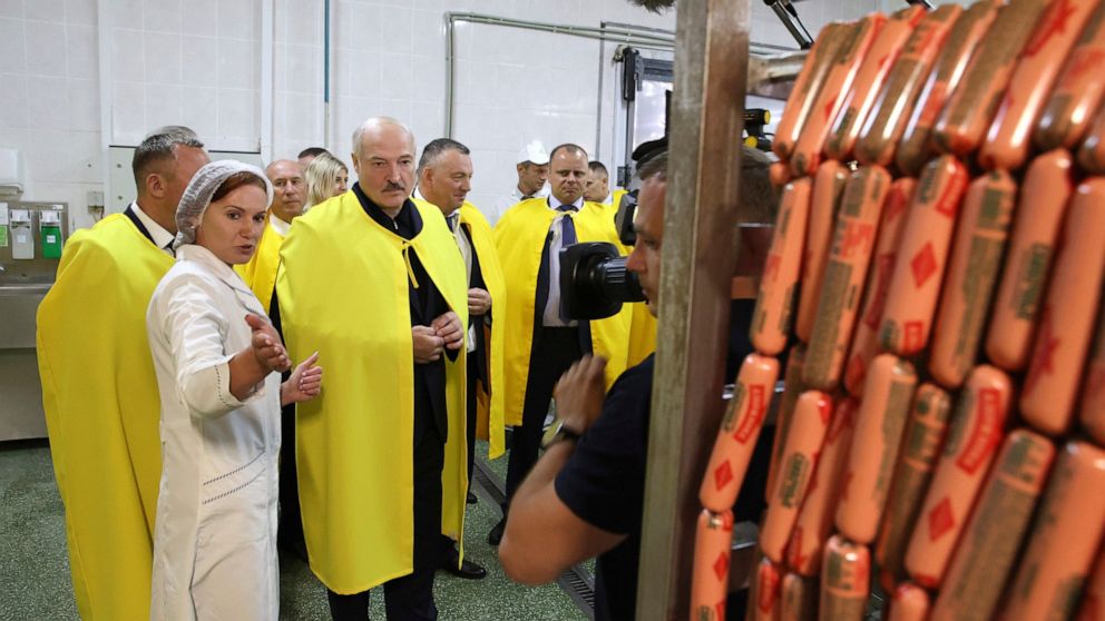 Belarusian President Alexander Lukashenko visits the agricultural plant "Dzerzhinsky" outside Minsk, Belarus, Friday, Aug. 21, 2020. Belarus' authorities have detained a leader of striking factory workers, raising pressure on the opposition amid mass