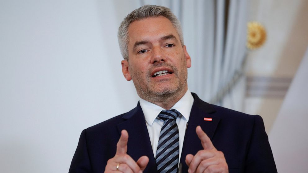 FILE - Austrian Chancellor Karl Nehammer addresses the media during a joint press conference with Hungarian Prime Minister Viktor Orban in Vienna, Austria, Thursday, July 28, 2022. The Austrian government has presented plans for a power price cap to 