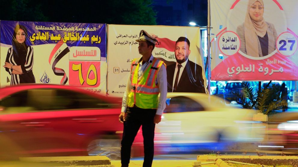 Campaign posters for upcoming early parliamentary elections are displayed in central Baghdad, Iraq, Wednesday, Sept. 29, 2021. Iraq's top Shiite cleric called Wednesday for wide participation in next month's parliament elections, saying that despite 