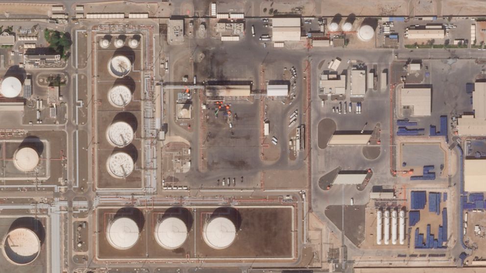 This satellite image provided Planet Labs PBC shows the aftermath of an attack claimed by Yemen's Houthi rebels on an Abu Dhabi National Oil Co. fuel depot in the Mussafah neighborhood of Abu Dhabi, United Arab Emirates, Saturday, Jan. 22, 2022. The 