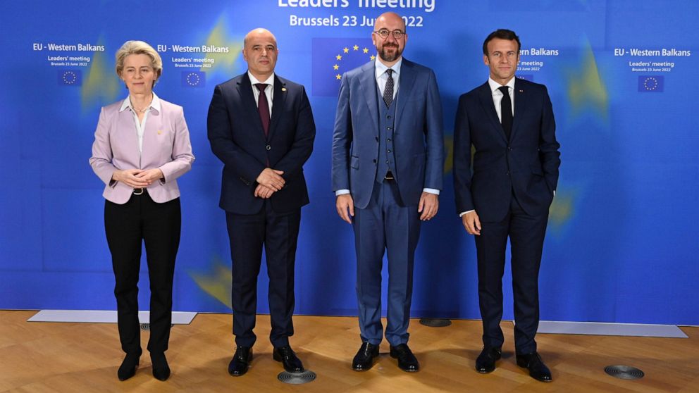 From left, European Commission President Ursula von der Leyen, North Macedonia's Prime Minister Dimitar Kovacevski, European Council President Charles Michel and French President Emmanuel Macron pose for a group photo during an EU summit in Brussels,