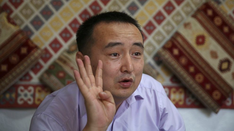 In this March 29, 2018, photo, Serikzhan Bilash, a prominent activist campaigning against Chinese internment camps, gestures as he speaks to The Associated Press at a restaurant in Almaty, Kazakhstan. Bilash was arrested by Kazakh police at an Almaty