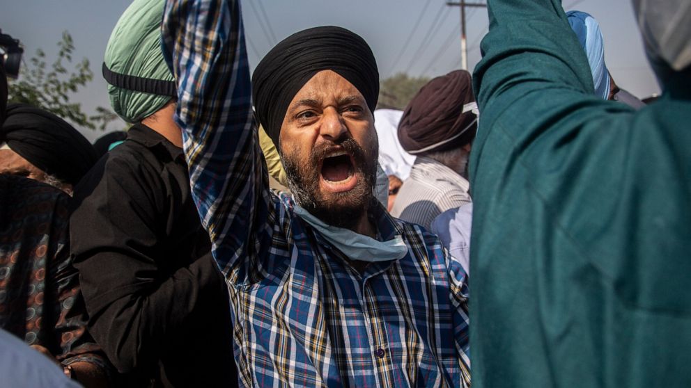 FILE - In this Oct. 8, 2021, file photo, Sikh community members shout slogans during the funeral of Supinder Kaur, a slain school principal in Srinagar, India. A spate of recent killings has rattled Indian-controlled Kashmir, with violence targeting 