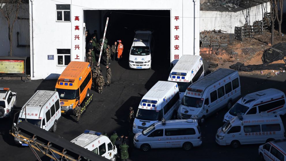 In this photo released by Xinhua News Agency, ambulance vehicles and rescuers gather at the Lijiagou coal mine of the Baiji Mining Co., Ltd. in Shenmu City, northwest China's Shaanxi Province, Sunday, Jan. 13, 2019. Twenty-one coal miners were killed