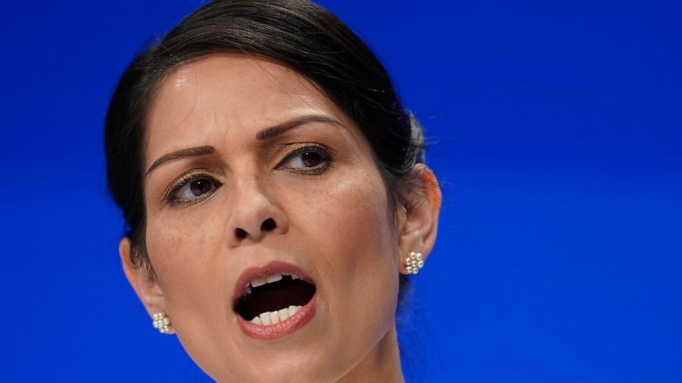 FILE - In this Tuesday, Oct. 5, 2021 file photo, Britain's Home Secretary Priti Patel speaks at the Conservative Party Conference in Manchester, England. The chief executive of Britain’s biggest phone company, BT, proposed the “walk me home” service 