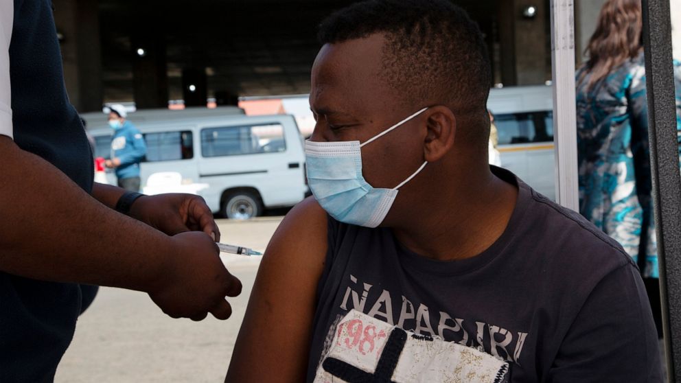A man receives a Johnson & Johnson vaccines at a pop-up vaccination centre, at the Bare taxi rank in Soweto, South Africa, Friday, Aug. 20, 2021. Faced with slowing numbers of people getting COVID-19 jabs, South Africa has opened eligibility to all a