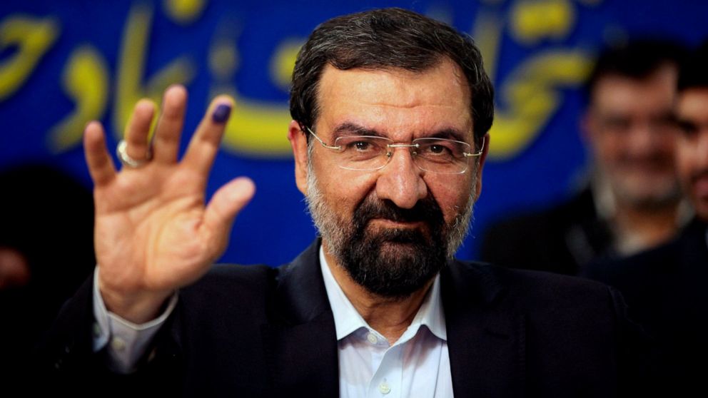 FILE - Mohsen Rezaei waves to reporters after registering as a presidential candidate, in Tehran, Iran, May 10, 2013. Argentina’s Foreign Ministry said Tuesday, Jan. 11, 2022, that the appearance of Rezaei, at the investiture of Nicaragua’s president