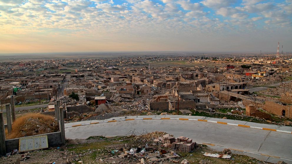 A view of deserted ruins in the northern Iraqi town of Sinjar, where the Iraqi army recently moved in to restore federal government control. Friday, Dec. 4, 2020. A new agreement aims to bring order to Iraq's northern region of Sinjar, home to the Ya