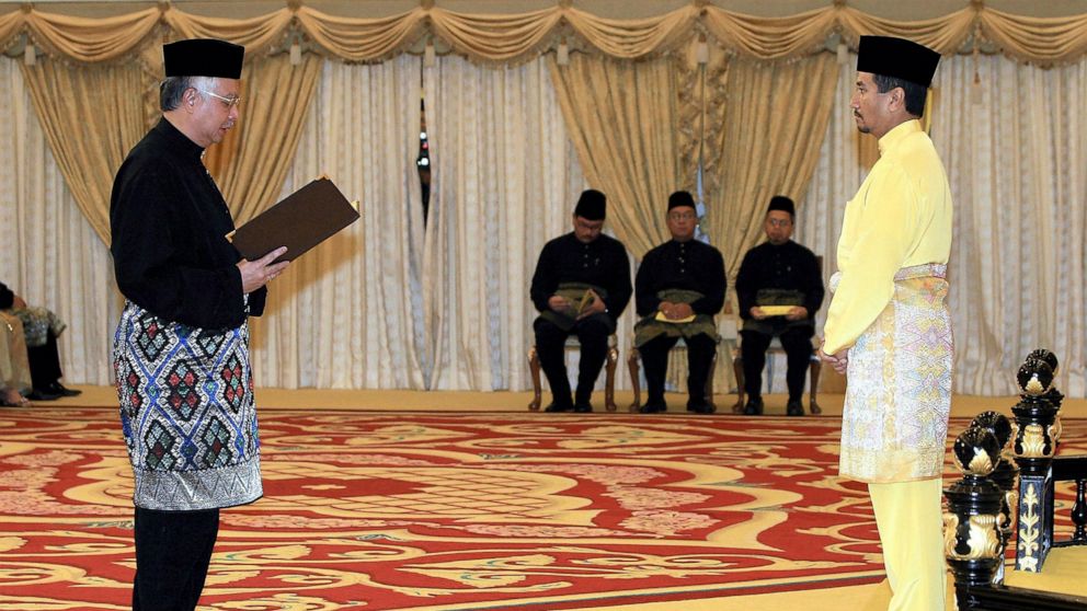 FILE - In this April 3, 2009, file photo Najib Razak, left, swears in as new Malaysian Prime Minister in front of Malaysian King Sultan Mizan Zainal Abidin at National Palace in Kuala Lumpur, Malaysia. Najib was found guilty Tuesday, July 28, 2020, i