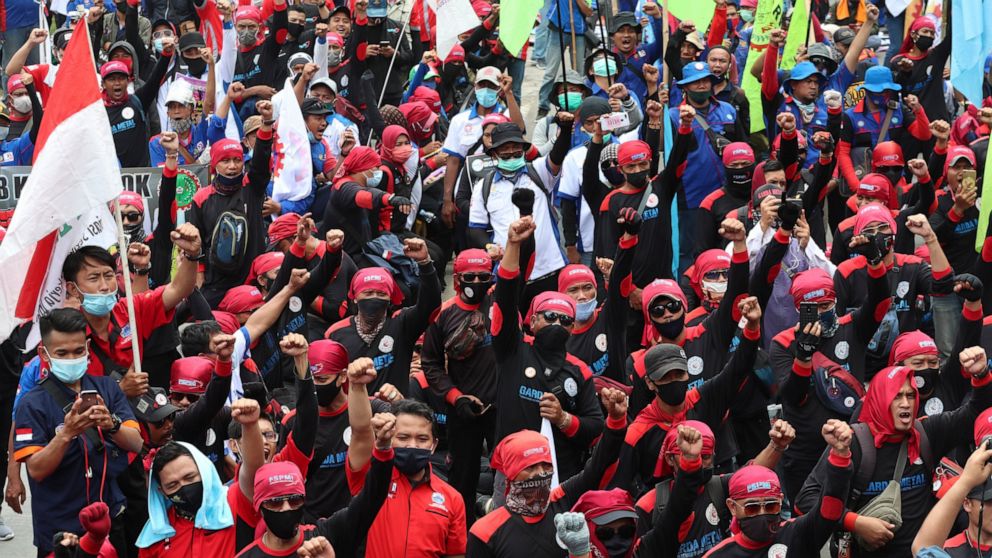Labor demonstrators shout slogans during a protest against new Job Creation Law in Jakarta, Indonesia, Monday, Nov. 2, 2020. Thousands of workers in Indonesia on Monday continued their protests against the country's new jobs law that critics say will