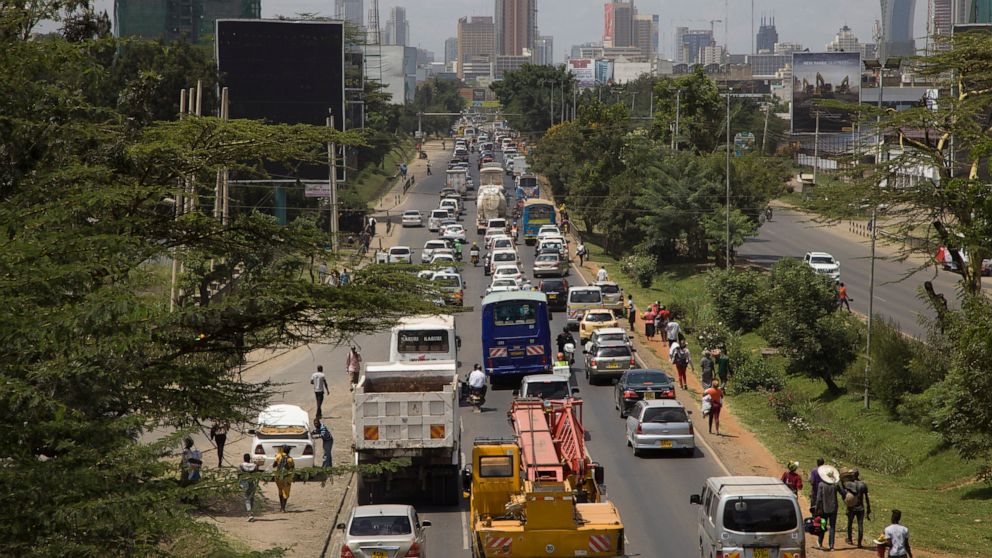 In this photo taken Thursday, Feb. 13, 2020, traffic sits queued up on Uhuru Highway leading to downtown Nairobi, Kenya. In many parts of sub-Saharan Africa new wheels often mean a used car from Japan or Europe which are affordable to the growing mid