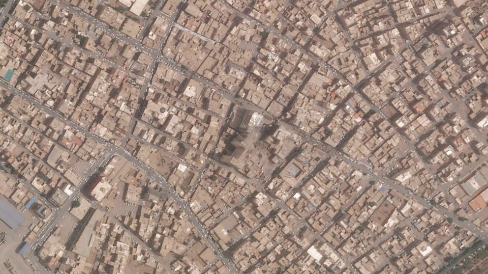 This satellite photo from Planet Labs PBC shows the Metropol Building collapse site, center, in Abadan, Iran, Thursday, May 26, 2022. Iranian riot police fired tear gas and shot into the air to disperse an angry crowd of hundreds of people near the s