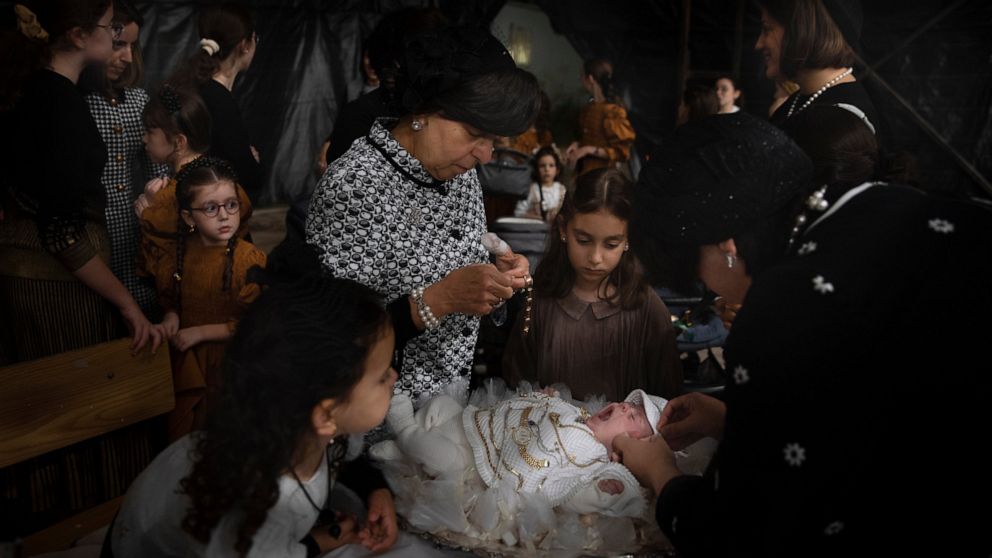 AP PHOTOS: Jews redeem firstborn son in ancient ceremony