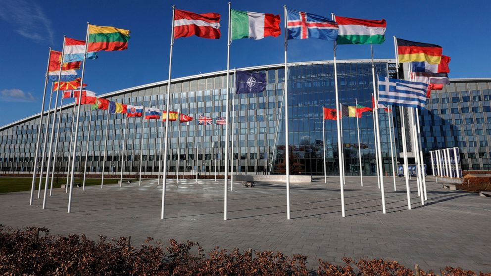 FILE - Flags flutter in the wind outside NATO headquarters in Brussels, Feb. 7, 2022. With Finland and Sweden taking steps to join NATO, the list of “neutral” countries in Europe appears poised to shrink. Security concerns over Russia’s ongoing invas