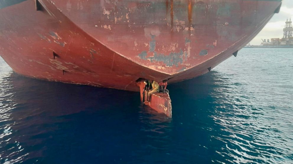 In this photo released by Spain's Maritime Safety and Rescue Society on Tuesday Nov. 29, 2022, three men are photographed on an oil tanker anchored in the port of the Canary Islands, Spain. Spain’s Maritime Rescue Service says it has rescued three st