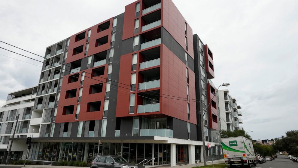 An apartment building stands on a corner in a Sydney suburb on Thursday, Aug. 4, 2022. The Sydney apartment where the bodies of two Saudi sisters were found in June is back on the rental market with a real estate ad advising their deaths were "not a 