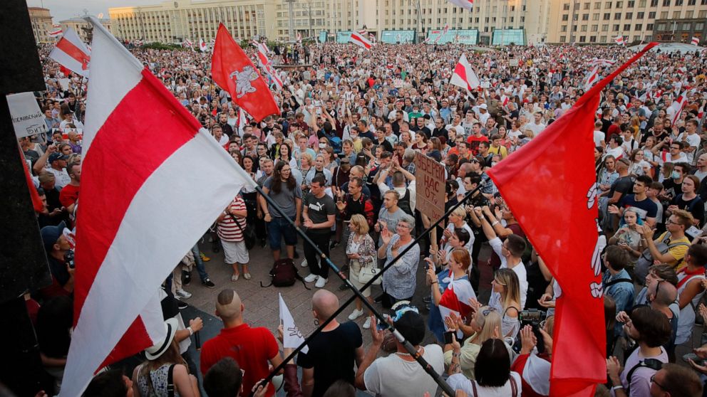 Belarusian opposition supporters gather for a protest rally in front of the government building at Independent Square in Minsk, Belarus, Tuesday, Aug. 18, 2020. Workers at more state-controlled companies and factories took part in the strike that beg