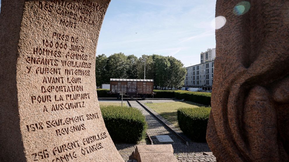 A memorial is pictured near a train car symbolizing the Drancy camp, at the Shoah memorial Tuesday, July 12, 2022 in Drancy, outside Paris. The Paris mayor and head of the French Holocaust Memorial will mark the 80th anniversary of the round-up of th
