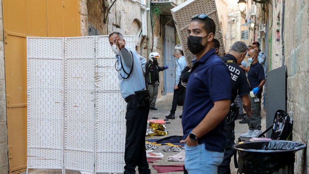 Israeli police examine the scene of a stabbing attack in Jerusalem's Old City, Thursday, Sept. 30, 2021. Israeli police say an alleged Palestinian attacker has been shot and killed after a stabbing attack in Jerusalem's Old City. (AP Photo/Mahmoud Illean)