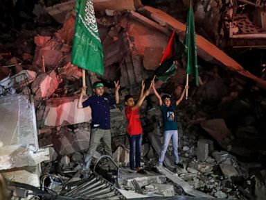 Palestinians see victory in Gaza truce as Israel warns Hamas