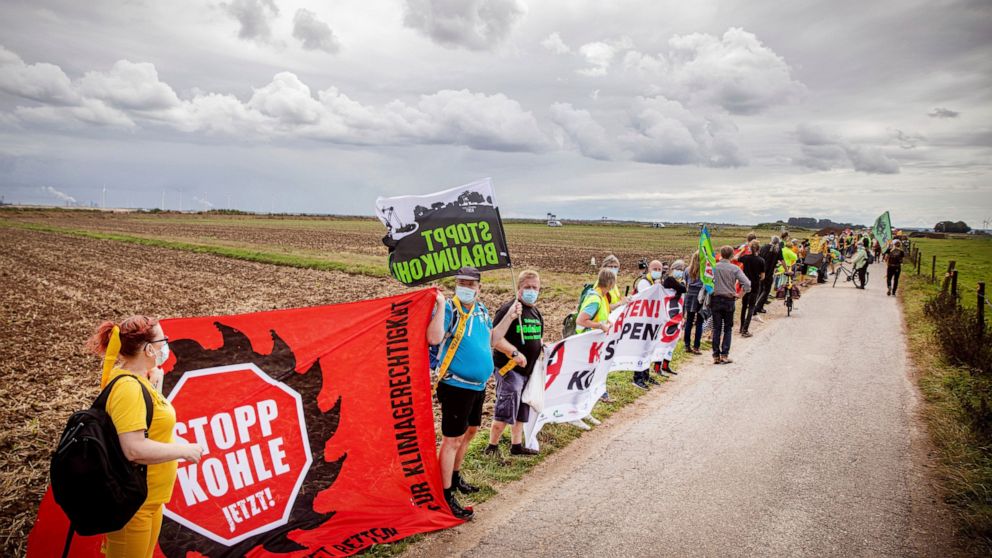 Activists form human chain demanding exit from coal mining