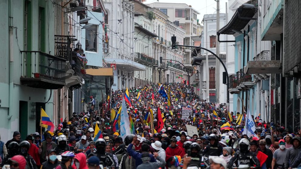 Anti-government protesters march to the presidential palace in Quito, Ecuador, Wednesday, June 22, 2022. Protests by Indigenous people demanding a variety of changes, including lower fuel prices, have paralyzed Ecuador's capital and other regions, bu