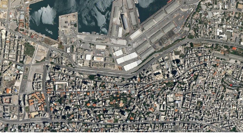A combo of satellite images of the port of Beirut and the surrounding area in Lebanon, top, taken on May 31, 2020 and the bottom taken on Wednesday Aug. 5, 2020 that shows the destruction following a massive blast on Tuesday. Residents of Beirut conf