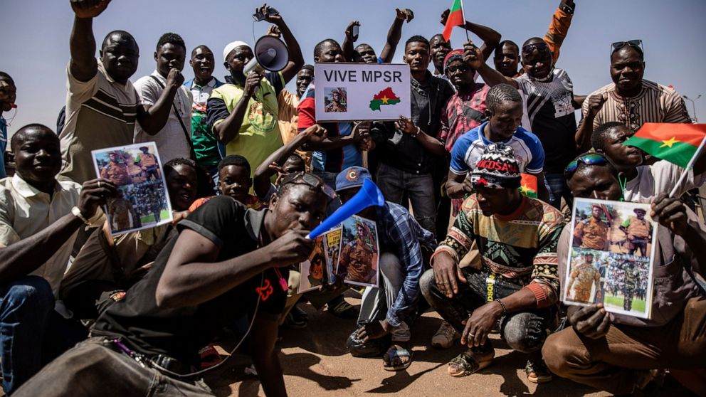 FILE - People take to the streets of Ouagadougou, Burkina Faso, Jan. 25, 2022 to rally in support of the new military junta that ousted democratically elected President Roch Marc Christian Kabore and seized control of the country. Officials from the 