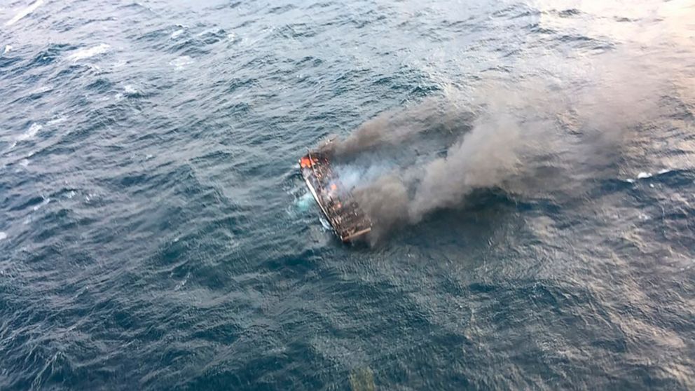 This photo provided by the Korea Jeju Coast Guard, shows a fishing boat in a smoke in waters near the southern island of Jeju, in South Korea, Tuesday, Nov. 19, 2019. South Korea's coast guard says about a dozen people are missing from a fishing boat