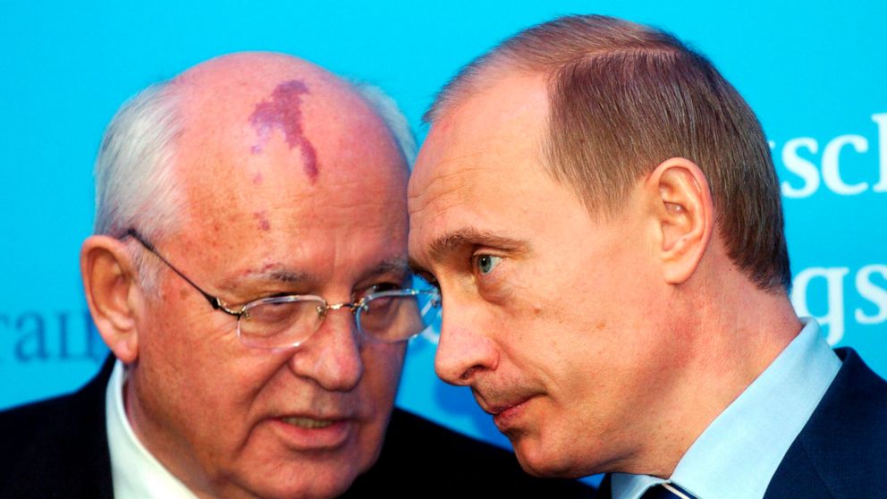 FILE - Russia's President Vladimir Putin, right, talks with former Soviet President Mikhail Gorbachev at the start of a news conference at the Castle of Gottorf in Schleswig, northern Germany, Tuesday, Dec. 21, 2004. Russian news agencies are reporti