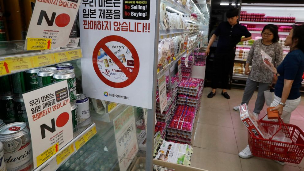 FILE - In this Tuesday, July 9, 2019, file photo, notices campaigning for a boycott of Japanese-made products are displayed at a store in Seoul, South Korea. South Koreans believe Japan still hasn't fully acknowledged responsibility for atrocities co