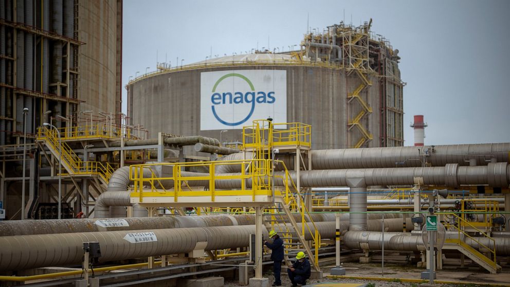 FILE - Operators work at the Enagss regasification plant, the largest LNG plant in Europe, in Barcelona, Spain, Tuesday, March 29, 2022. The European Union’s plan to reduce the bloc’s gas use by 15% to prepare for a potential cutoff by Russia this wi