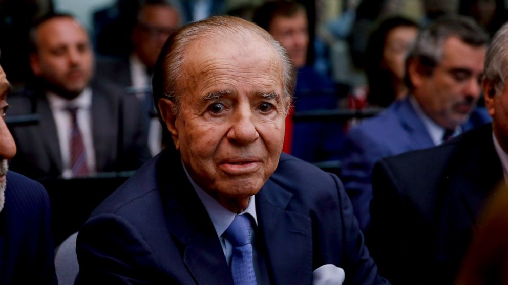 FILE - In this Feb. 28, 2019 file photo, former Argentine President Carlos Menem sits in a courthouse in Buenos Aires, Argentina. Menem has been admitted to a hospital in Buenos Aires on Saturday, June 13, 2020, after being diagnosed with pneumonia. 