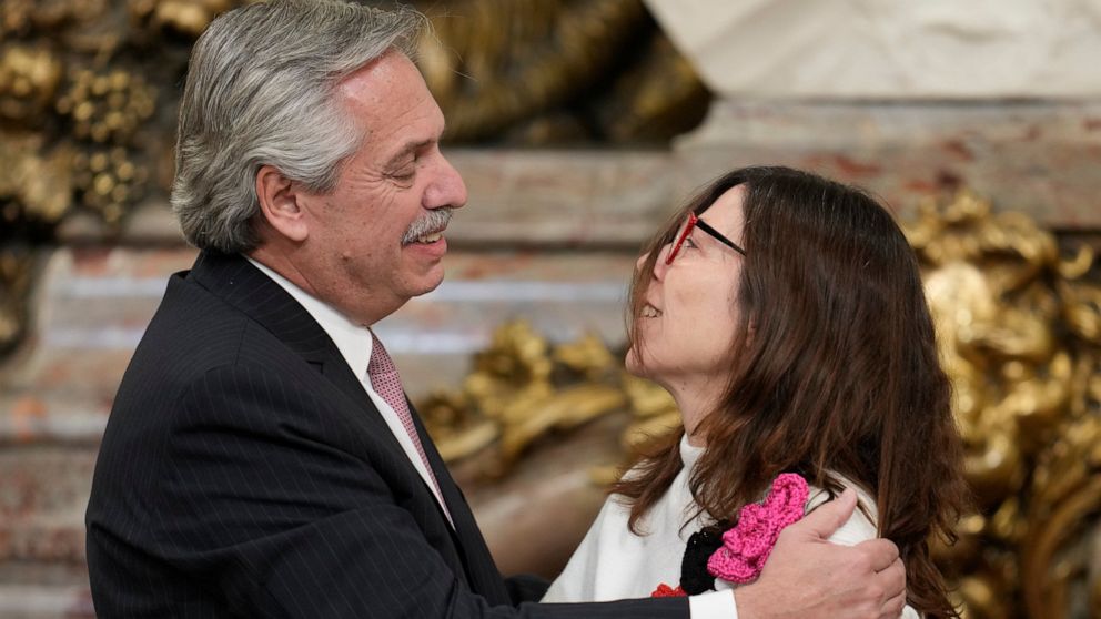 President Alberto Fernandez embraces his new Economy Minister Silvina Batakis at the government house in Buenos Aires, Argentina, Monday, July 4, 2022. Batakis will replace Martín Guzmán who quit unexpectedly Saturday, posting a seven-page resignatio