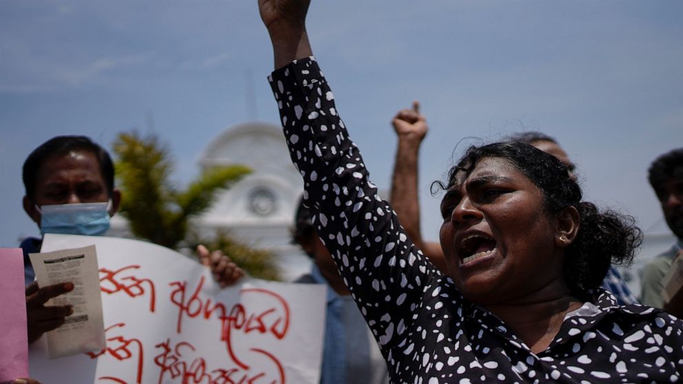 An anti government protester shouts slogans against the recent military eviction of their protest camp outside president's office in Colombo, Sri Lanka, Wednesday, July 27, 2022. Sri Lanka's economic crisis has left the nation’s 22 million people str