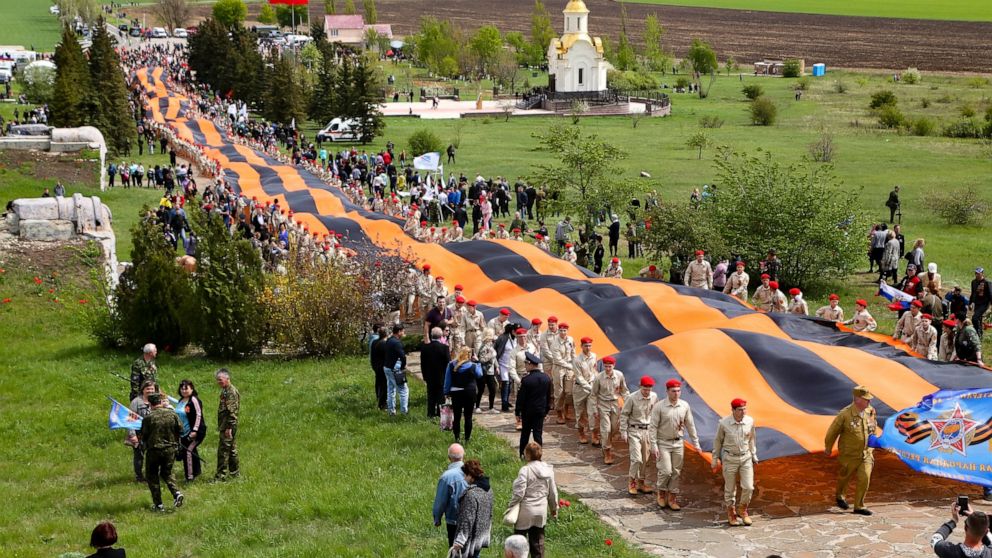 Ukraine's leader marks end of WWII in village near Russia