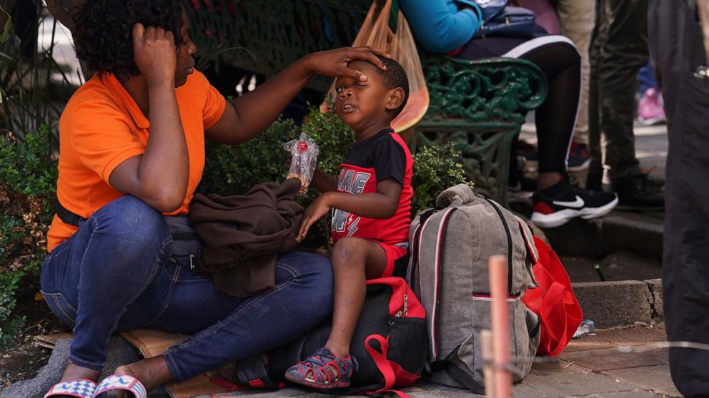 Haitian migrant children arrive with their parents at the Mexican Commission for Refugee Assistance, COMAR, to request refuge in Mexico City, Wednesday, Sept. 22, 2021. (AP Photo / Marco Ugarte)