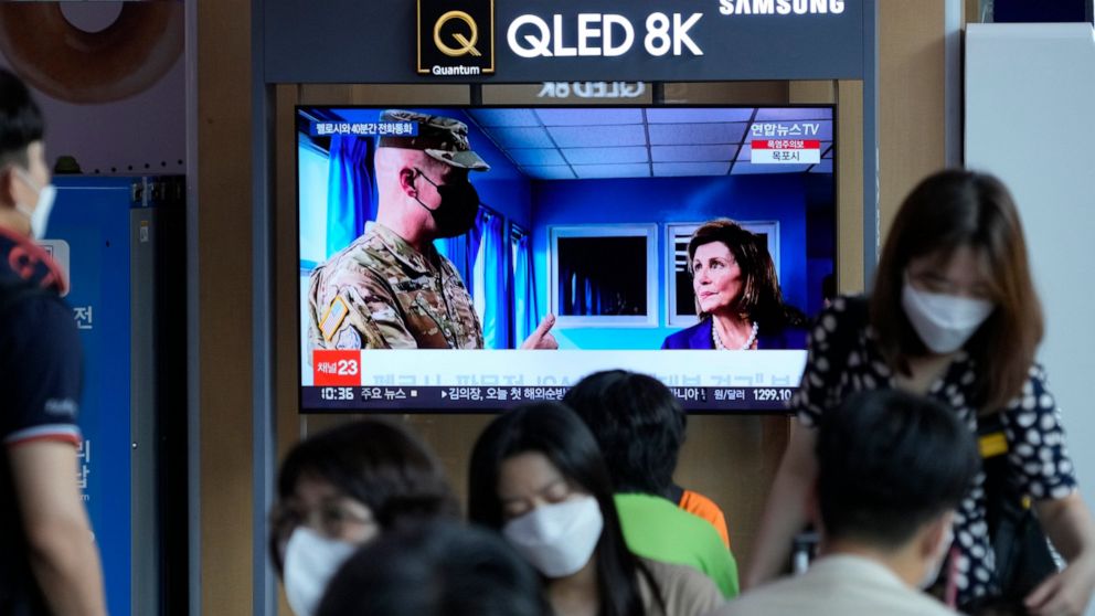 A TV screen shows a news program reporting about U.S. House Speaker Nancy Pelosi was visiting the Joint Security Area of the inter-Korean truce village of Panmunjom, at the Seoul Railway Station in Seoul, South Korea, Friday, Aug. 5, 2022. North Kore