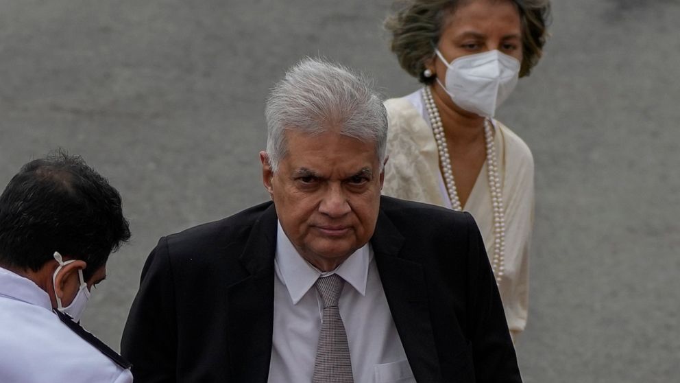 Sri Lankan president Ranil Wickremesinghe and his wife Maithree arrive at the parliamentary complex in Colombo, Sri Lanka, Wednesday, Aug. 3, 2022. (AP Photo/Eranga Jayawardena)