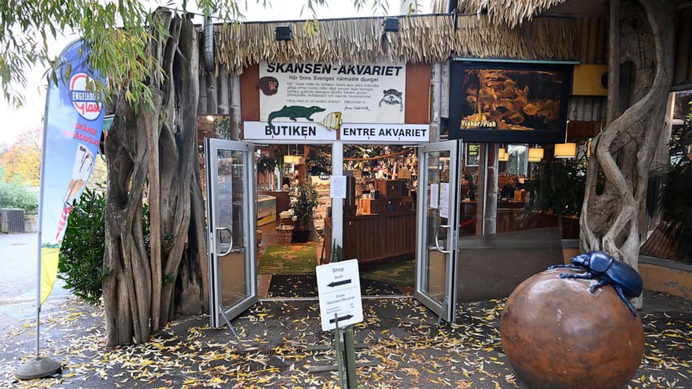 The Skansen Aquarium's entrance, part of the zoo on Djurgarden island, where a deadly snake escaped on Saturday via a light fixture in the ceiling of its glass enclosure, in Stockholm, Sweden, Monday Oct. 24, 2022. A venomous king cobra which escaped