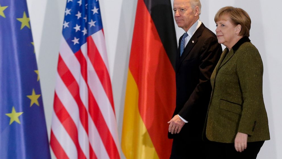 FILE - In this Feb. 1, 2013 file photo, German Chancellor Angela Merkel, right, and United States' Vice President Joe Biden walk at the chancellery in Berlin, Germany. Angela Merkel has just about seen it all when it comes to U.S. presidents. Merkel 