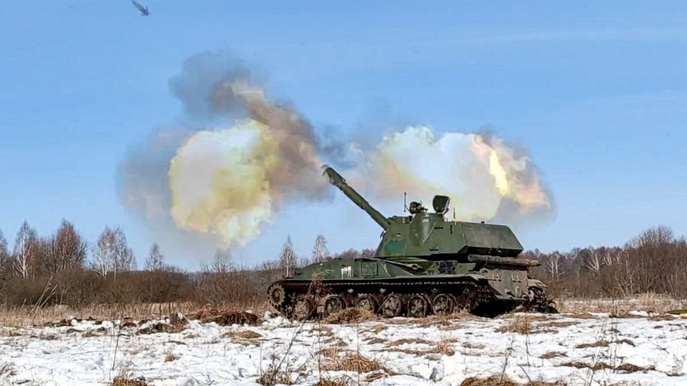 FILE - In this photo taken from video provided by the Russian Defense Ministry Press Service on Tuesday, Feb. 15, 2022, a self-propelled artillery mount fires at the Osipovichi training ground during the Union Courage-2022 Russia-Belarus military dri