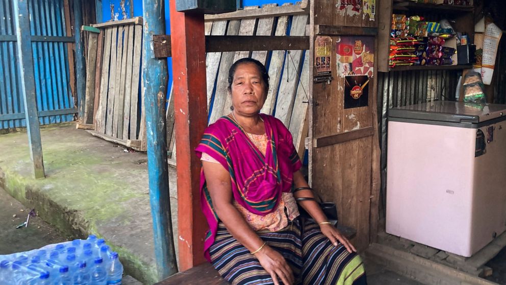 Tribal woman Modhumala Chakma, sits in front of a shop in Rangamati district of Bangladesh, Sunday, Nov. 27, 2022. Bangladesh is marking 25 years since it signed a peace treaty to end an armed insurgency in southeastern Bangladesh. (AP Photo/Al-emrun